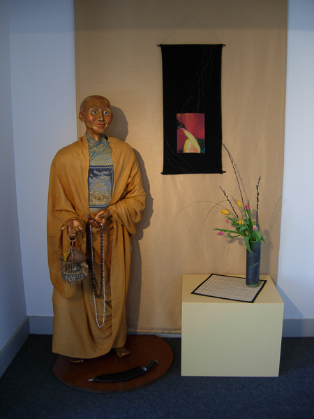 <p style="text-align: center;">Installation of Avalokiteshvara, fiber art and flowers as part of a Shambhala Art Festival in Brunswick, Maine</p>